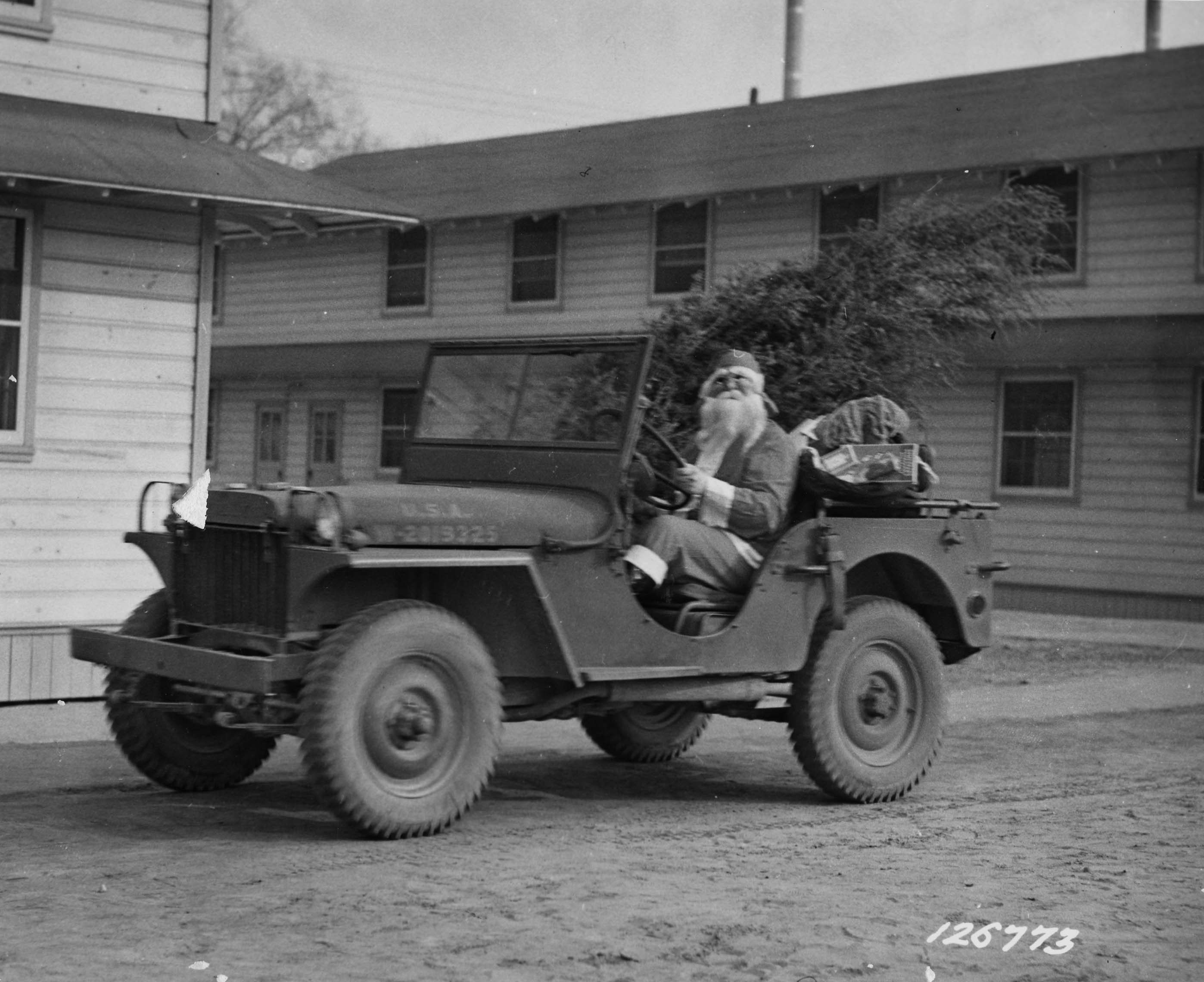 US Army soldier dressed as Santa Claus at Camp Lee, Virginia, United States, December, 1941