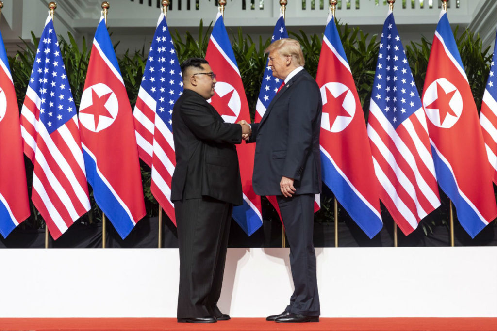 Kim_and_Trump_shaking_hands_at_the_red_carpet_during_the_DPRK–USA_Singapore_Summit