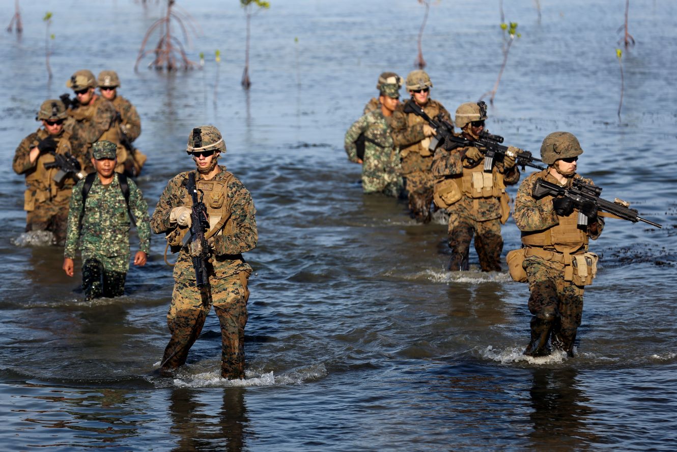 A Marine stands guard near the site of the Marine Battalion