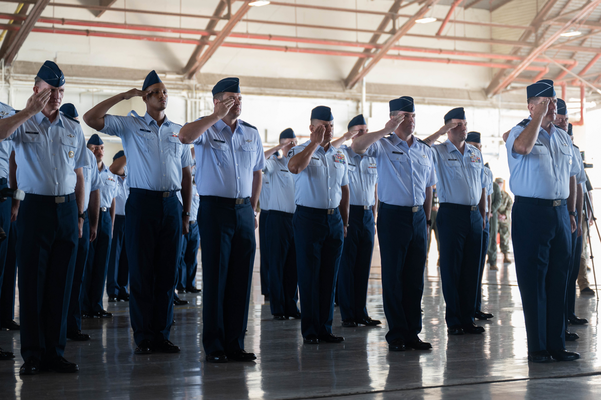 salute during the 19th Air Force change of command ceremony