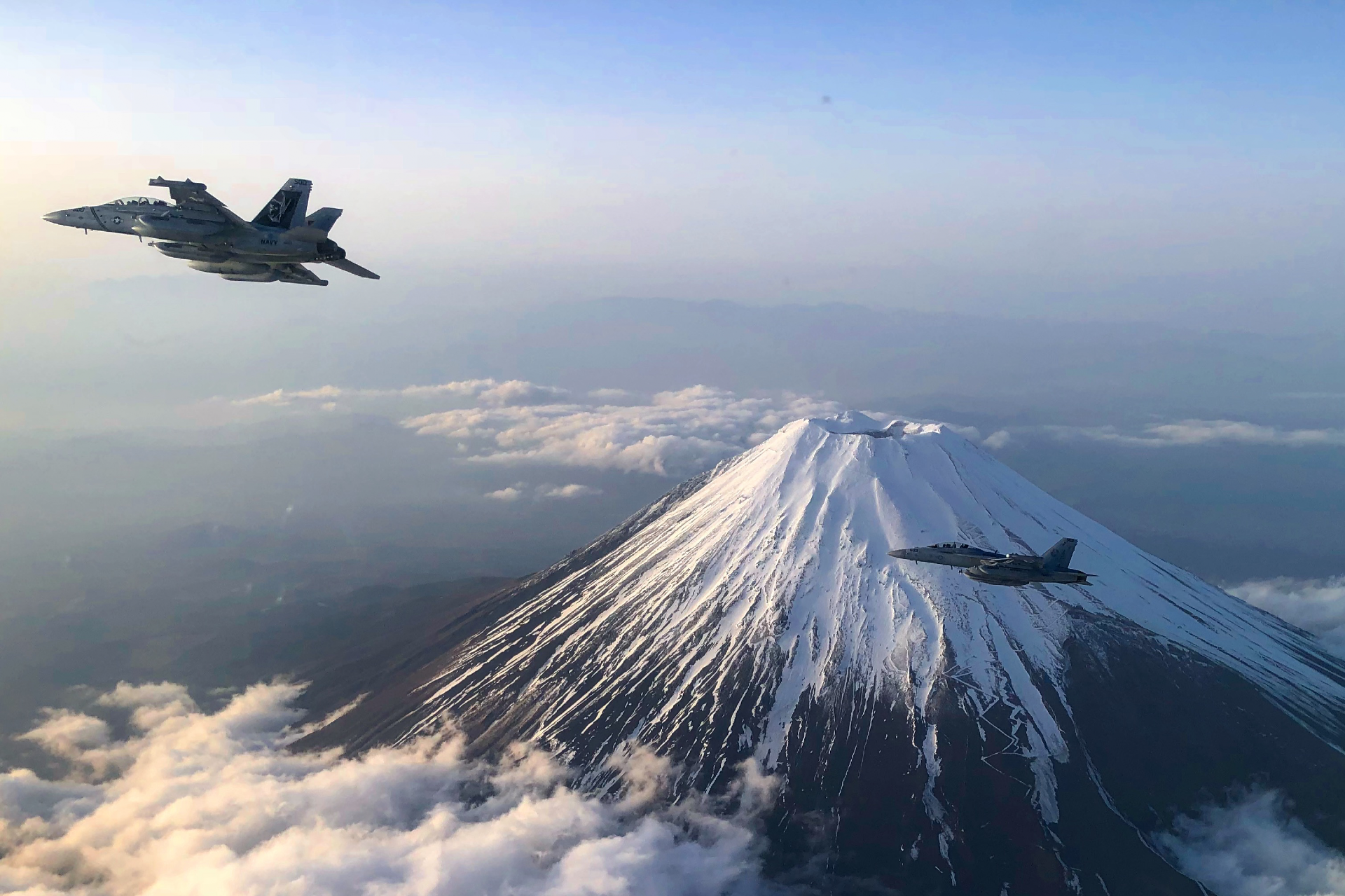 EA-18Gs fly in formation over Mt. Fuji in Japan