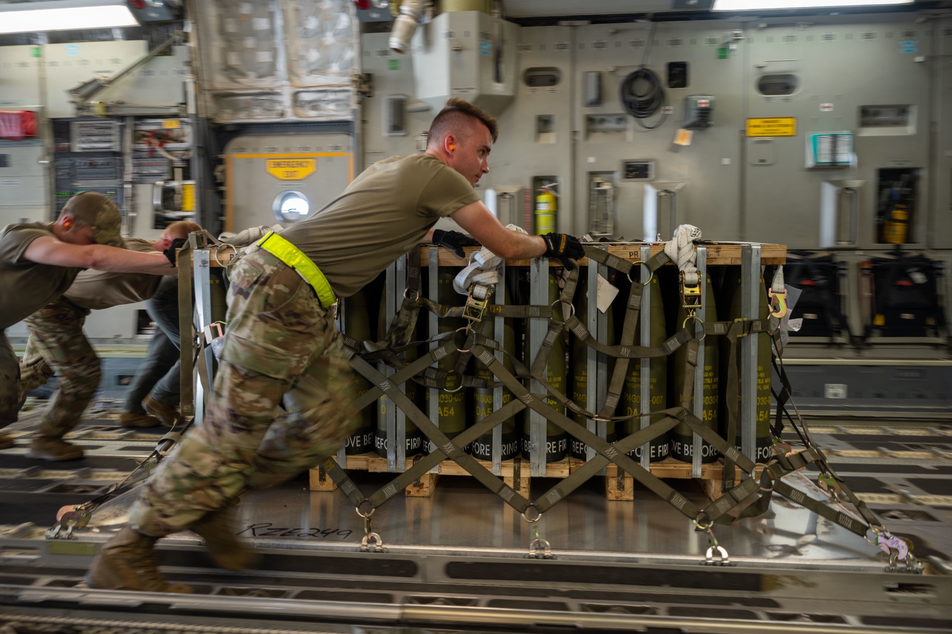 Airmen load pallets of ammunition onto a C-17 Globemaster III bound for Ukraine