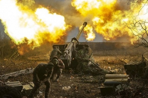 Ukrainian soldiers fire artillery