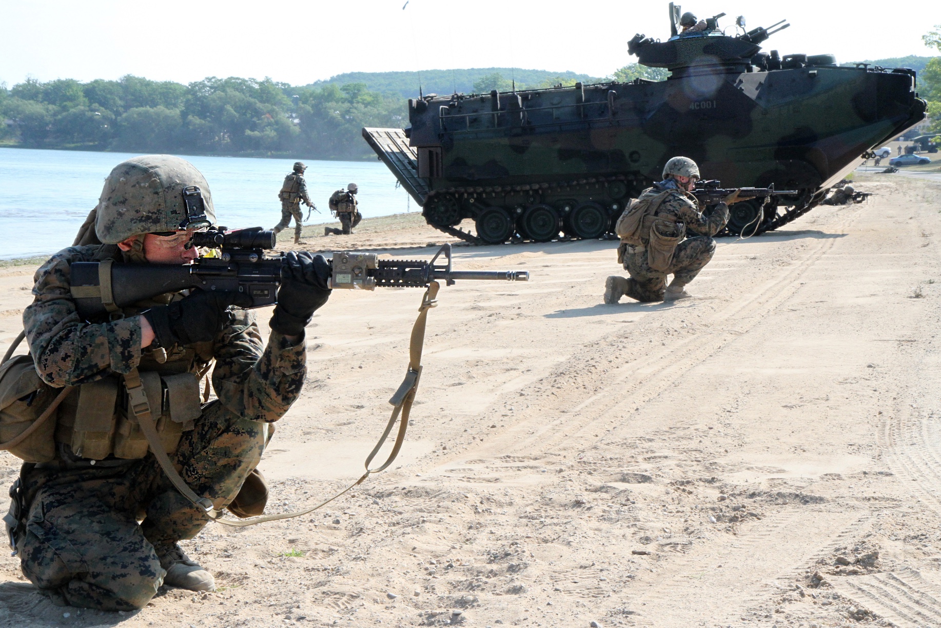 Marines from the 2nd Platoon, Company C, 4th Amphibious Assault Vehicle Battalion, based in Galveston, Texas, approach the shores of Lake Margrethe, Aug. 11, 2016, to rehearse security operations during an amphibious assault that is part of Northern Strike 2016