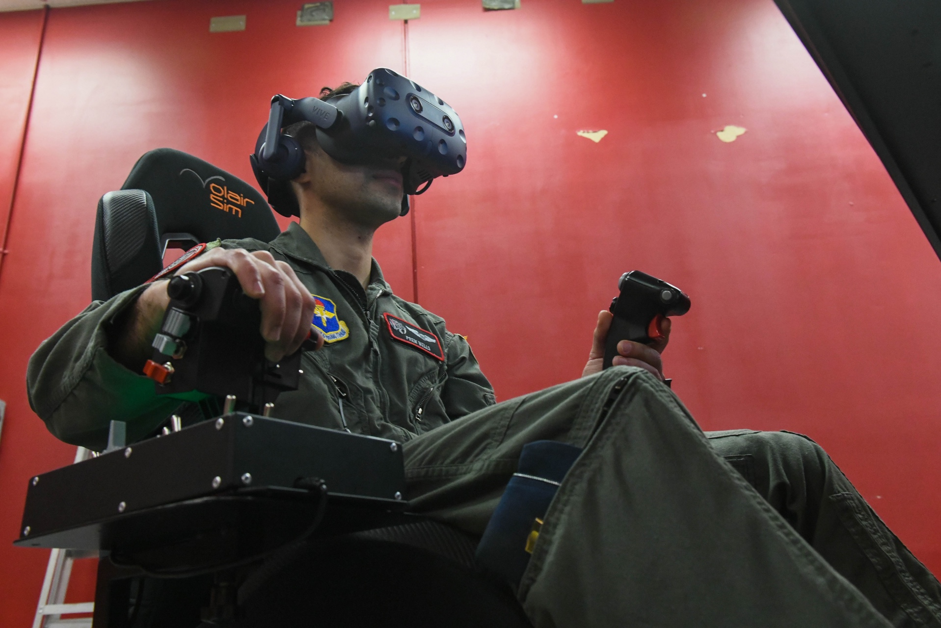 A student uses a C-17 virtual reality pilot simulator at Altus Air Force Base