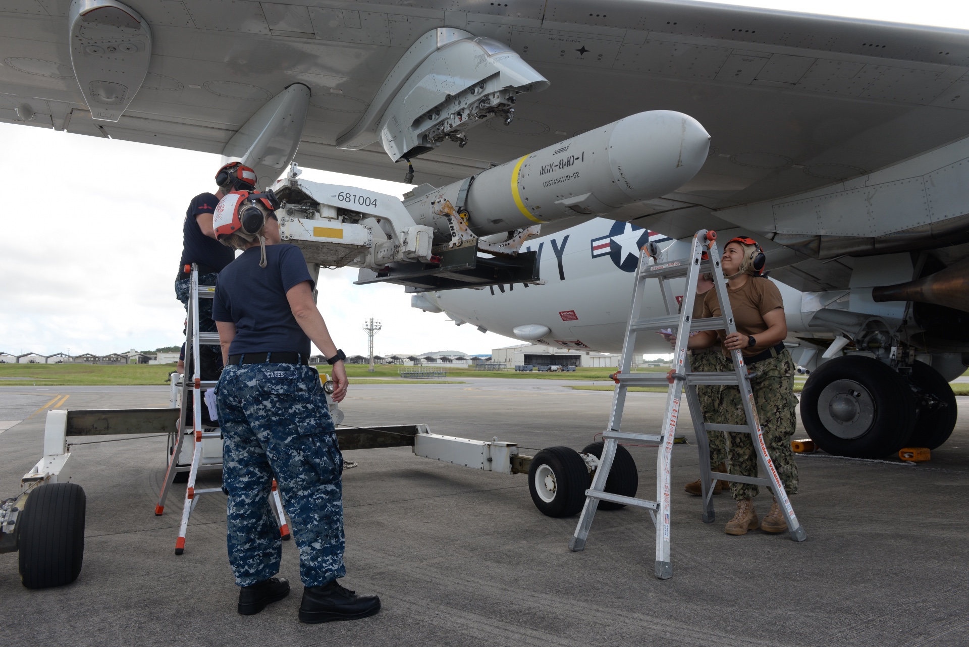Sailors assigned to the Fighting Tigers of Patrol Squadron (VP) 8 use a forklift to onload an AGM-84D Harpoon missile onto a P-8A Poseidon aircraft at Kadena Air Base, Japan