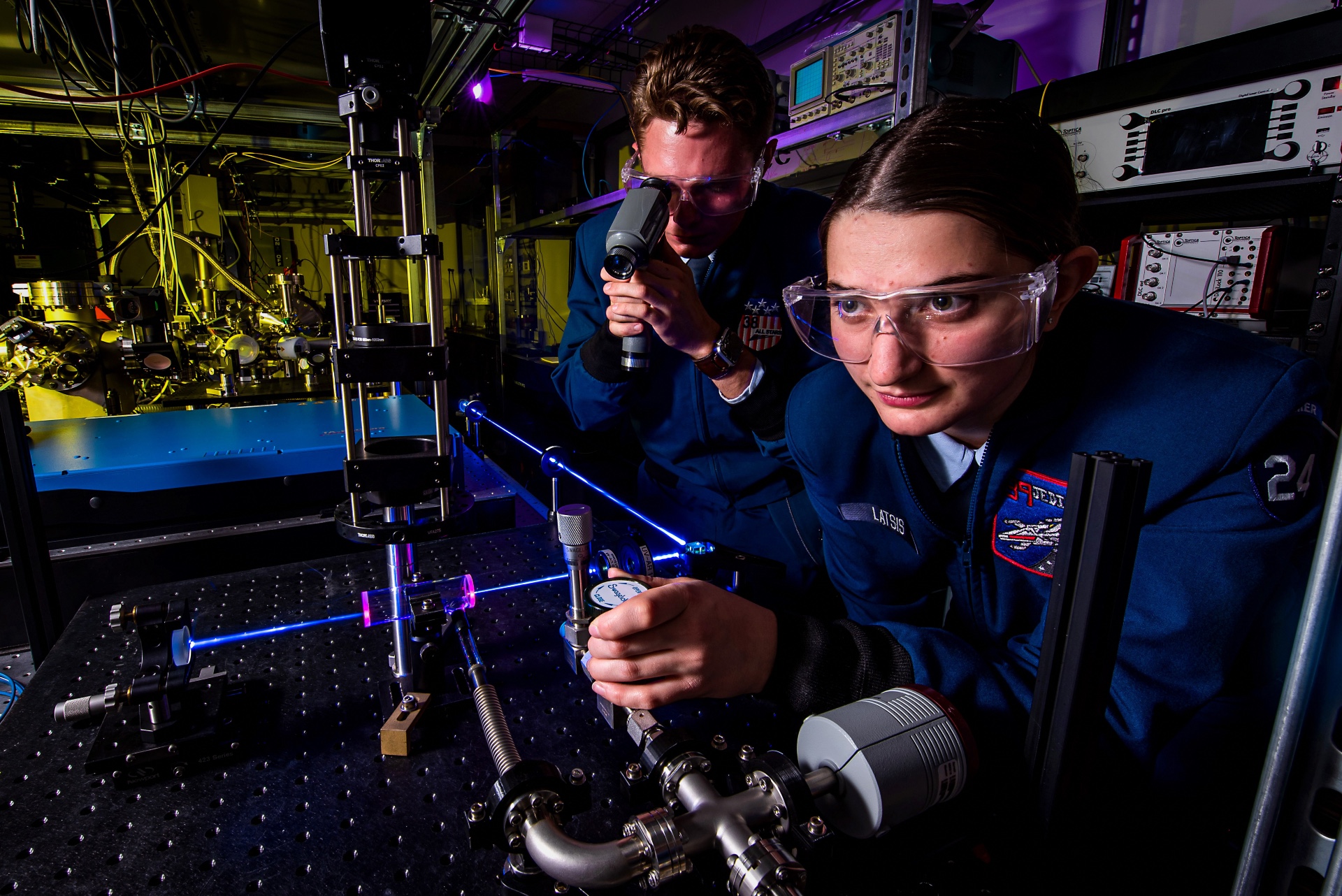 Cadets Elizabeth Latsis and John Caldwell perform research using lasers in the U.S. Air Force Academy's Laser and Optics Research Center, Nov. 4, 2021.