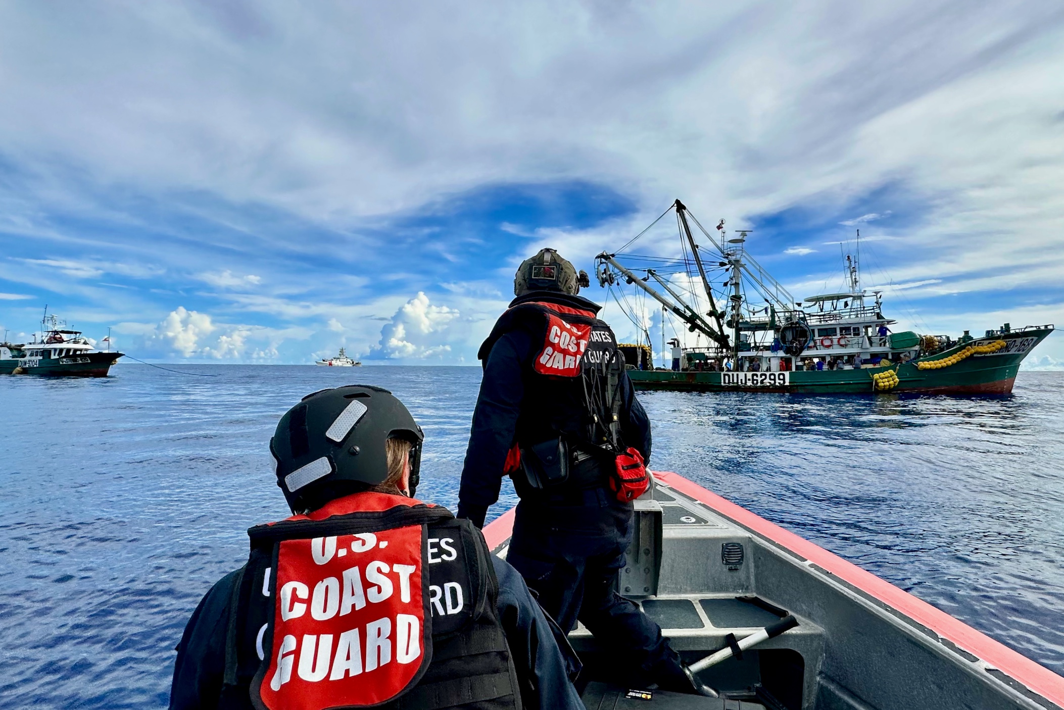 The crew of USCGC Oliver Henry (WPC 1140) approaches a Philippine-flagged purse seine fishing vessel in the North Pacific Ocean on March 31, 2023