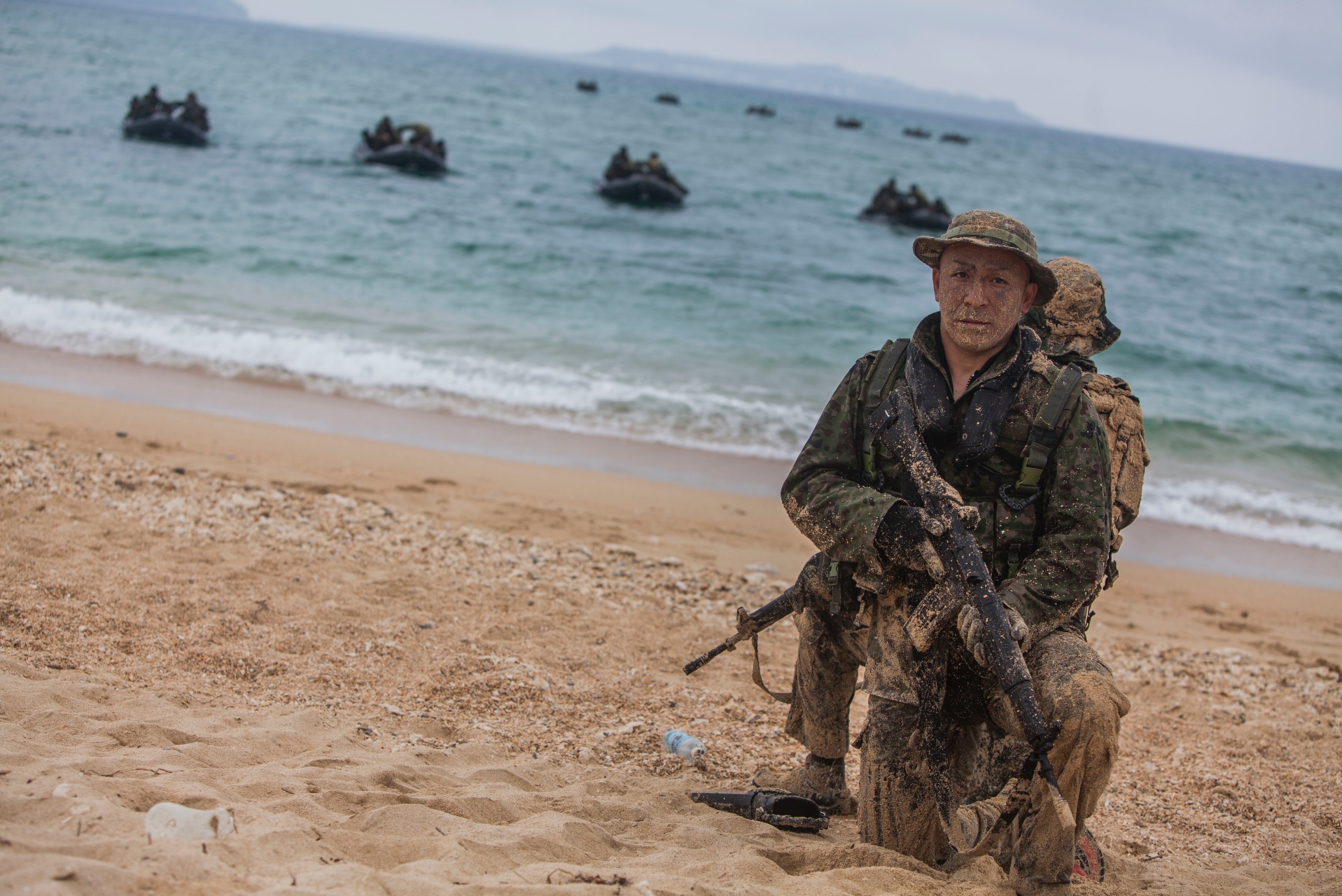Scout swimmers with Japan Ground Self Defense Force (JGSDF) provide security during boat operations as part of the Japan Observer Exchange Program on Kin Blue, Okinawa, April 28, 2015