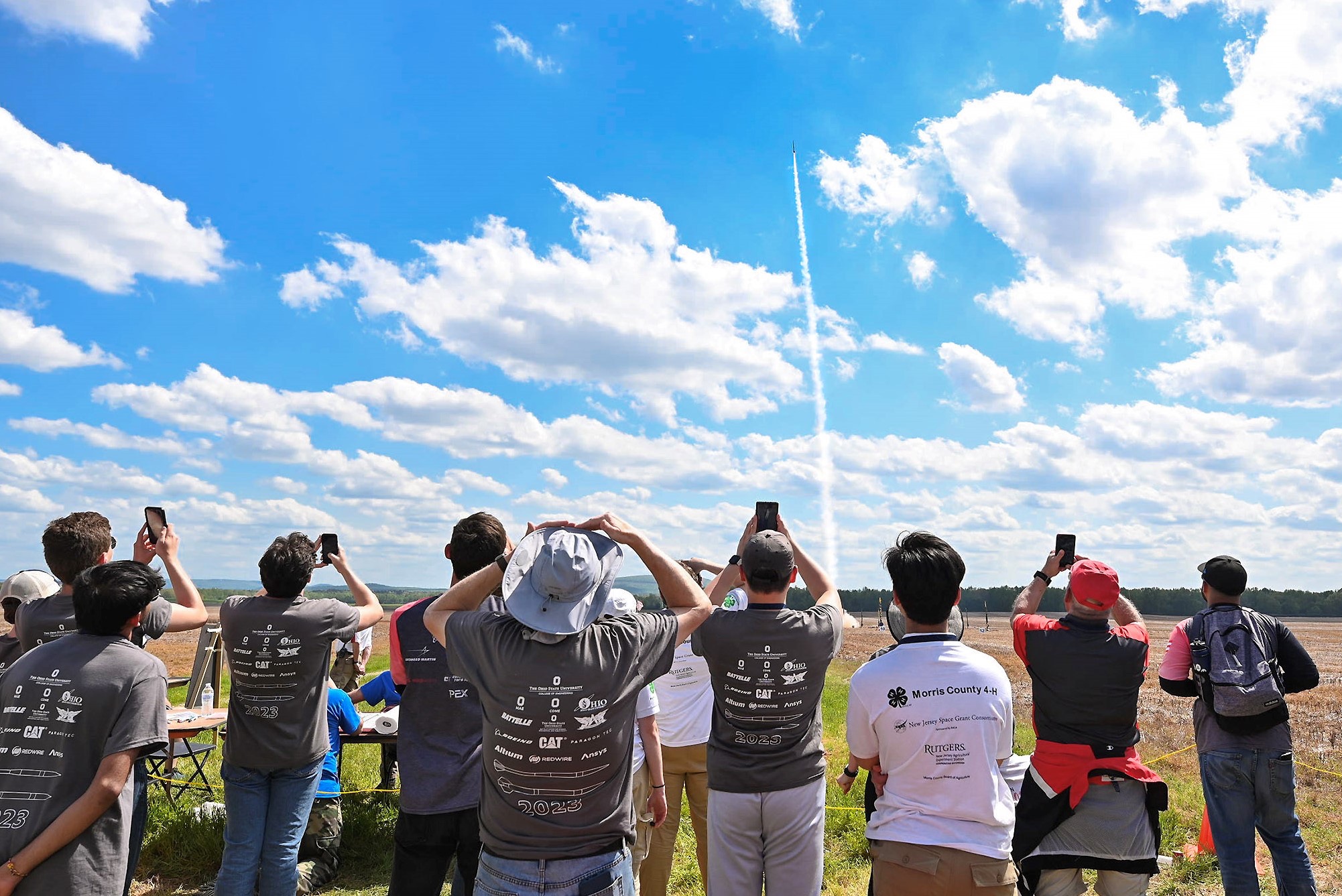 Students watch a high-powered amateur rocket launch during NASA’s 2023 Student Launch competition near NASA’s Marshall Space Flight Center in Huntsville, Alabama.