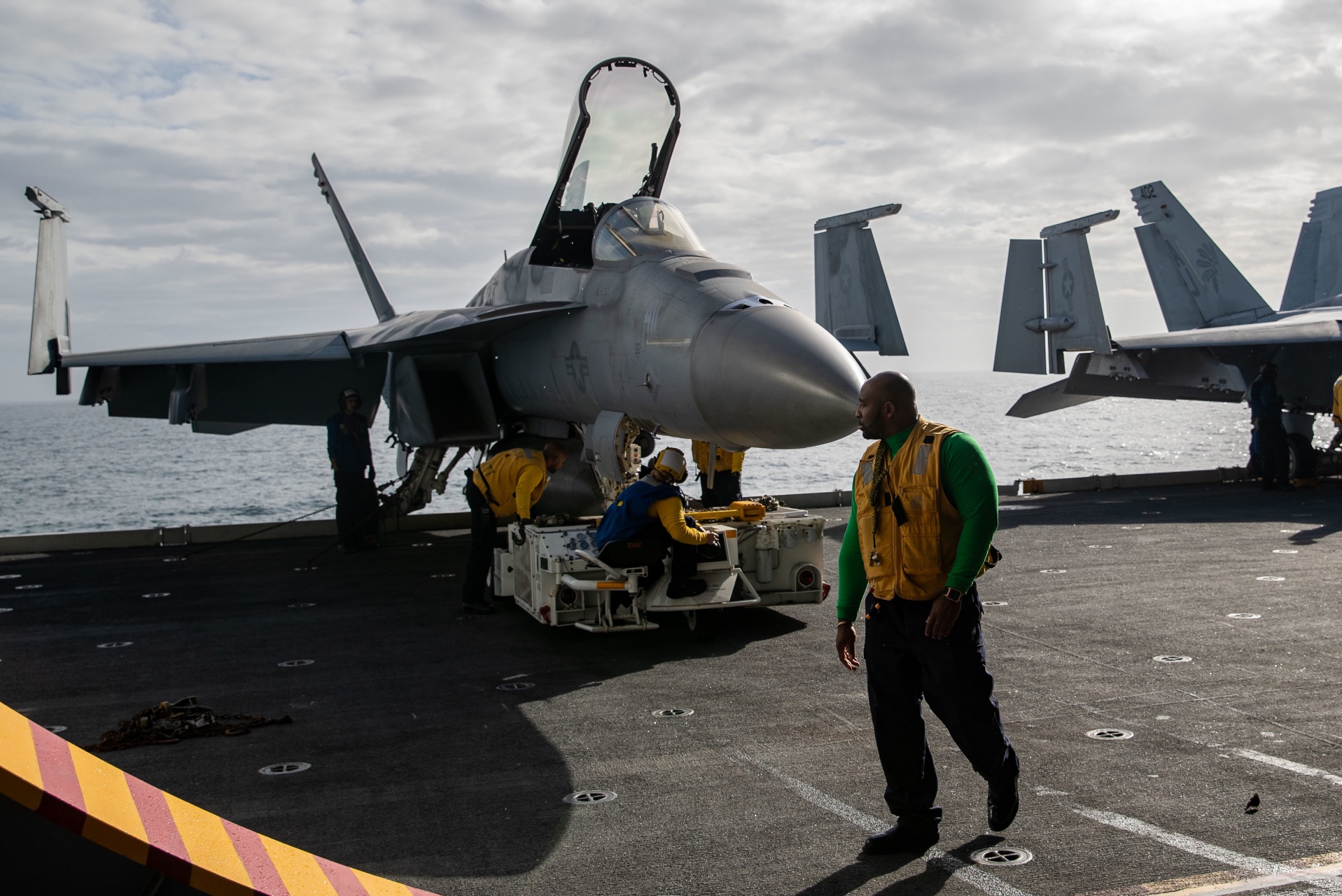 Sailors assigned to the "Golden Warriors" of Strike Fighter Squadron (VFA) 87, move F/A-18E Super Hornets to the first-in-class aircraft carrier USS Gerald R. Ford’s (CVN 78) hangar bay, Nov. 1, 2022