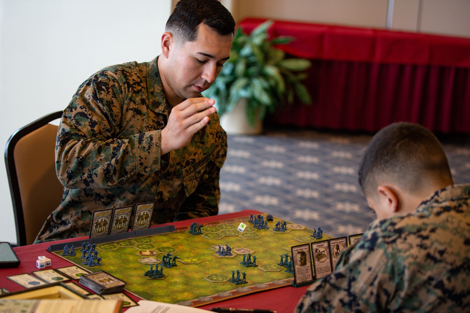 U.S. Marine Corps Sgt. Eddie Franco rolls dice during a game of Memoir 44’ on Camp Schwab, Okinawa, Japan, Dec. 10, 2019. Memoir 44’ is a war-themed strategy board game based on historical World War II battles.