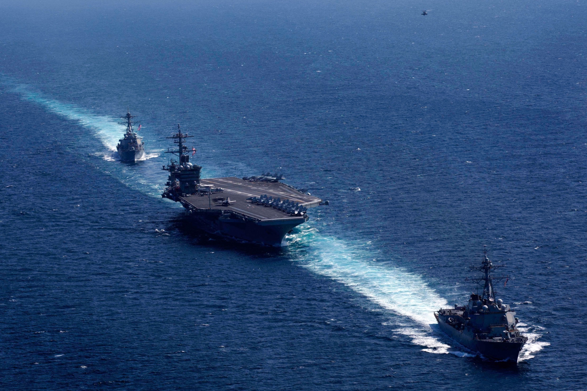 The Nimitz-class aircraft carrier USS Abraham Lincoln (CVN 72); the Arleigh Burke-class guided-missile destroyer USS Mason (DDG 87) from Destroyer Squadron 2; and the Arleigh Burke-class guided-missile destroyer USS Forrest Sherman (DDG 98) from Destroyer Squadron 28 transit the Atlantic Ocean.