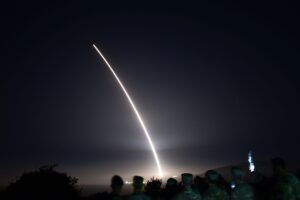 Nuclear Brinkmanship in AI-Enabled Warfare: A Dangerous Algorithmic Game of Chicken