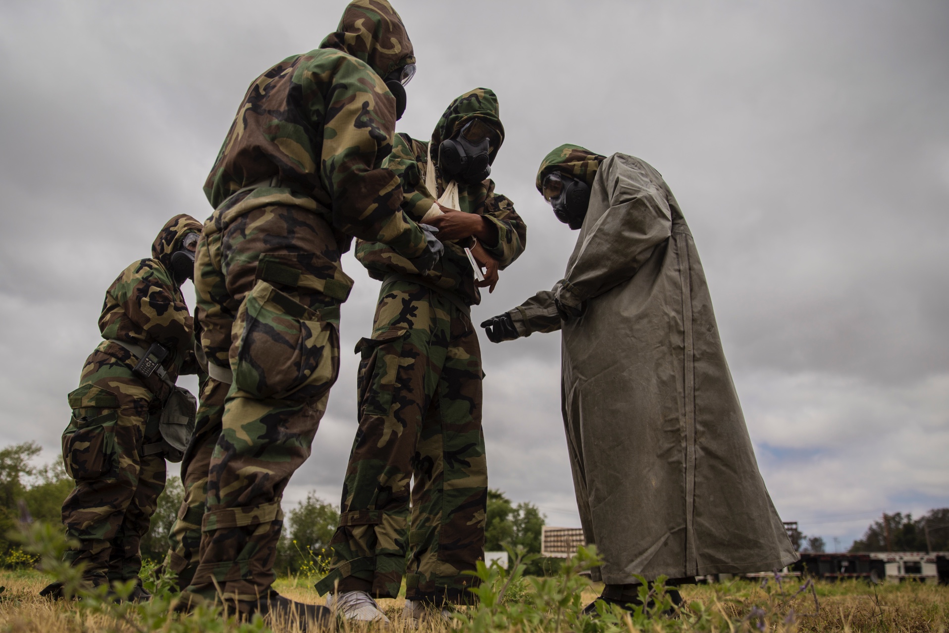 U.S. Marines and Sailors with Charlie Company, 1st Medical Battalion, 1st Marine Logistics Group, assess a simulated casualty during a Reconnaissance Surveillance and Decontamination course at Camp Pendleton, Calif