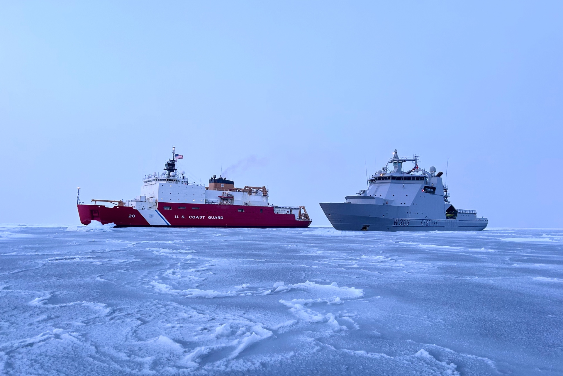 The U.S. Coast Guard Cutter Healy (WAGB 20) and the Norwegian Coast Guard Vessel Svalbard sail in formation while en route to conduct joint exercises in northern Norway in the Barents Sea, Sept. 27, 2023.