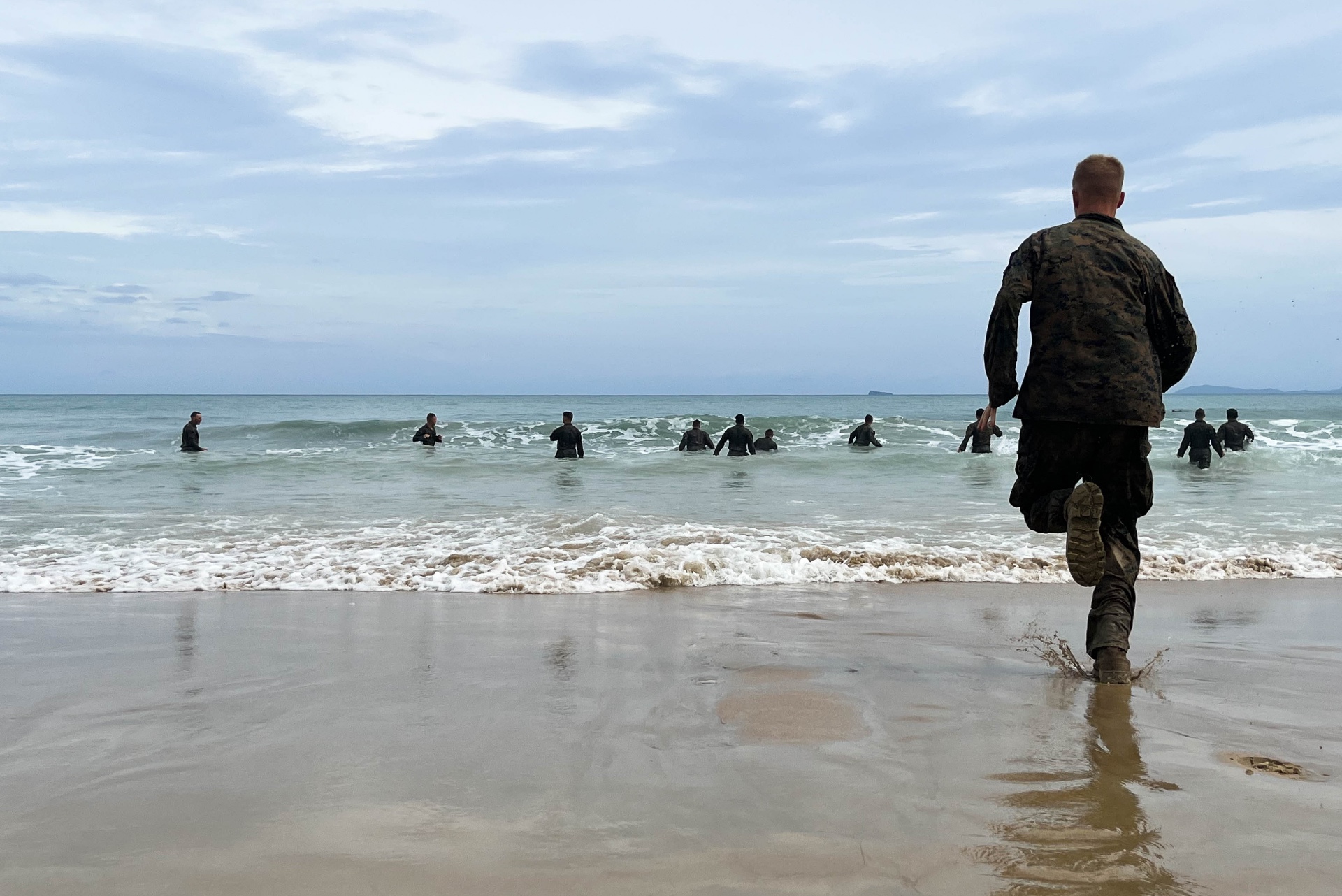 U.S. Marines with 2nd Battalion, 5th Marine Regiment, 1st Marine Division, run into the ocean during Marine Aviation Support Activity (MASA) 23 in Palawan, Philippines, July 16, 2023.