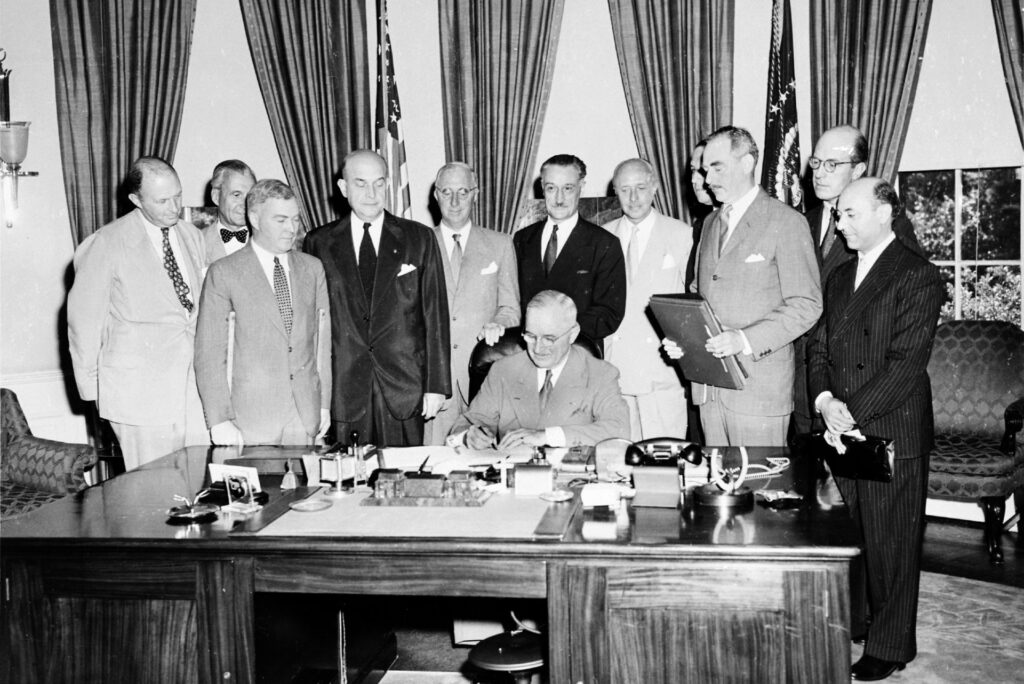 2560px-Truman_signing_North_Atlantic_Treaty
