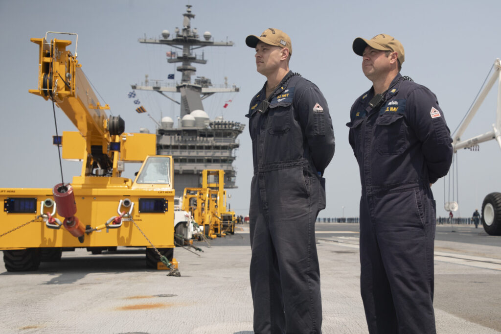 Sailors aboard USS George Washington man the rails in prepapration for underway